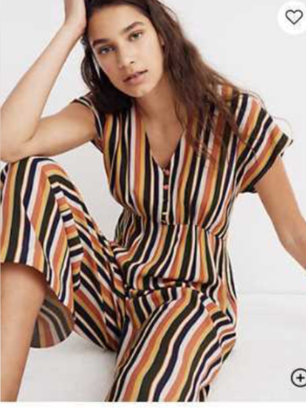 Madewell V-neck jumpsuit featuring a vibrant rainbow stripe pattern.